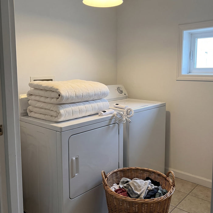 Washes like a regular mattress pad.