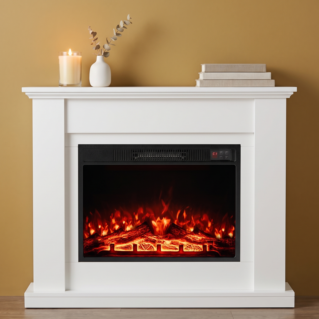 The Color Hearth electric fireplace insert glowing over realistic logs in a white mantel on a gold wall