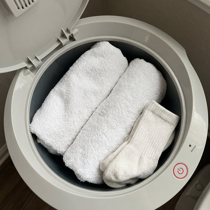 Holds two oversized towels.