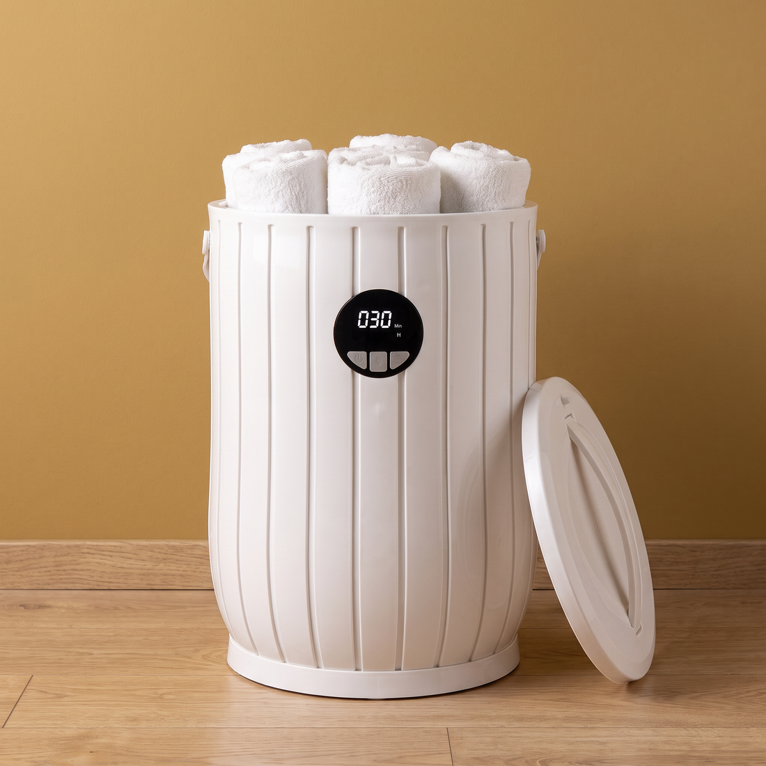 The Barrel Spa towel warmer with rolled towels against a gold wall